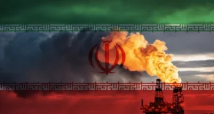 A natural gas drilling rig with the flag of Iran in the background.Shutterstock