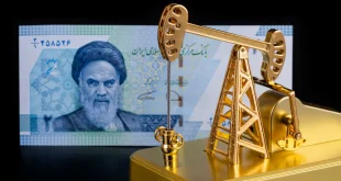 An Iranian banknote with a portrait of Ruhollah Khomeini and a gold model of an oil pump.Shutterstock