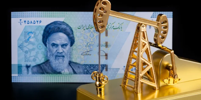 An Iranian banknote with a portrait of Ruhollah Khomeini and a gold model of an oil pump.Shutterstock