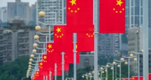 The main road is decorated with five-star red flags in Chongqing, China, September 23, 2023 [Costfoto/NurPhoto via Getty Images]