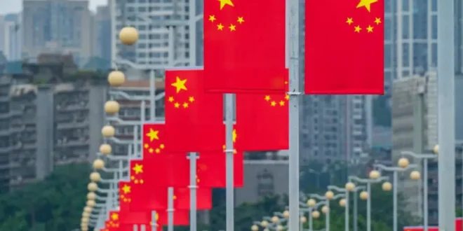 The main road is decorated with five-star red flags in Chongqing, China, September 23, 2023 [Costfoto/NurPhoto via Getty Images]