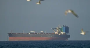 A ship waits to pass through the Strait of Hormuz following the two-week temporary ceasefire between the US and Iran, which is conditional on the opening of the strait, in Oman on April 8, 2026. Shipping traffic remained at low levels, reported. [Shady Alassar – Anadolu Agency]
