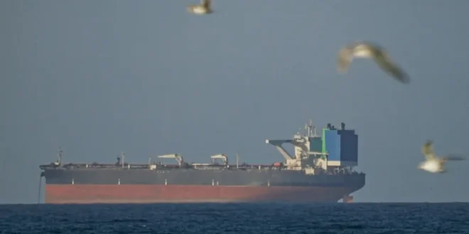 A ship waits to pass through the Strait of Hormuz following the two-week temporary ceasefire between the US and Iran, which is conditional on the opening of the strait, in Oman on April 8, 2026. Shipping traffic remained at low levels, reported. [Shady Alassar – Anadolu Agency]