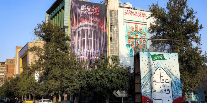 An anti-U.S. billboard featuring a burning White House is displayed on the facade of a building in Tehran’s Palestine Square this week. (AFP/Getty Images)