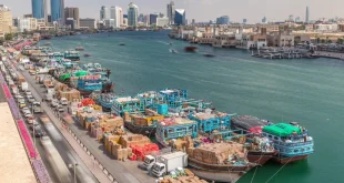 Workers load a ship in Dubai, United Arab Emirates.Shutterstock