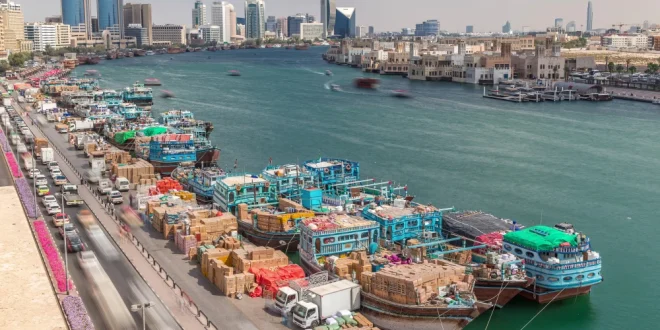 Workers load a ship in Dubai, United Arab Emirates.Shutterstock