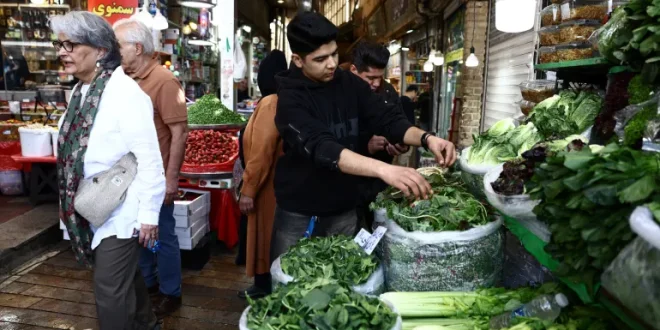 People shop at a market, amid the US-Israel conflict with Iran, in Tehran, Iran, March 24, 2026 [File -Majid Asgaripour/WANA (West Asia News Agency]